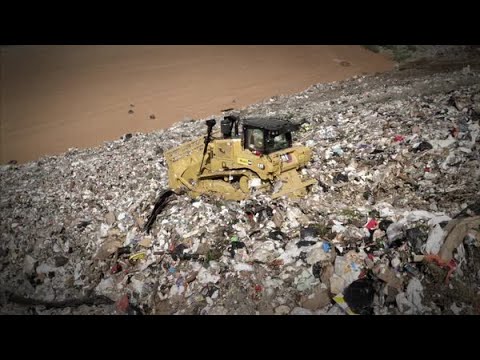 Cat® D6 XE Waste Handling Dozer at Work in a Landfill